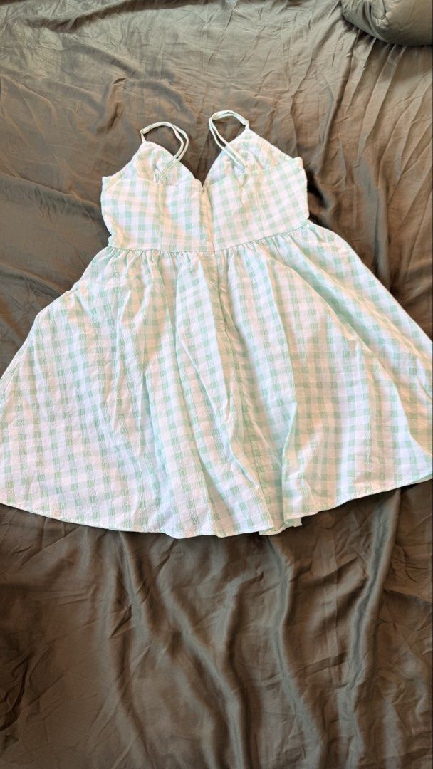 Zara Green Gingham Beaded Mini Dress (Category: Dresses) located in Batangas. Submitted by krieldre (Listing ID 1465776679, Image 2). Description: - Brand: Zara - Size: S - Style: Sleeveless mini dress with flouncy flared skirt and side zipper - Pattern: Green and white gingham seersucker fabric - Details: Cute beaded flower embellishments on the bust and adjustable thin straps - Condition: Excellent, great for warm weather.