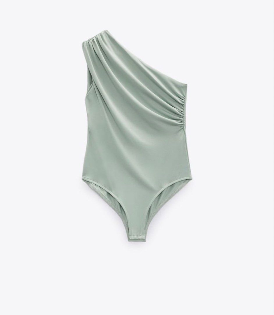 Zara One-Shoulder Draped Bodysuit Sage Green Size S (Category: Sleeveless) located in Pasay City. Submitted by closetbykim (Listing ID 1465787749, Image 1). Description: - Brand: Zara - Style: One-shoulder bodysuit with draped front and side ruching - Color: Soft sage green - Size: S - Condition: Worn once or twice, excellent shape - Material: Smooth and stretchy - Styling tip: Looks great with white trousers or denim jeans.