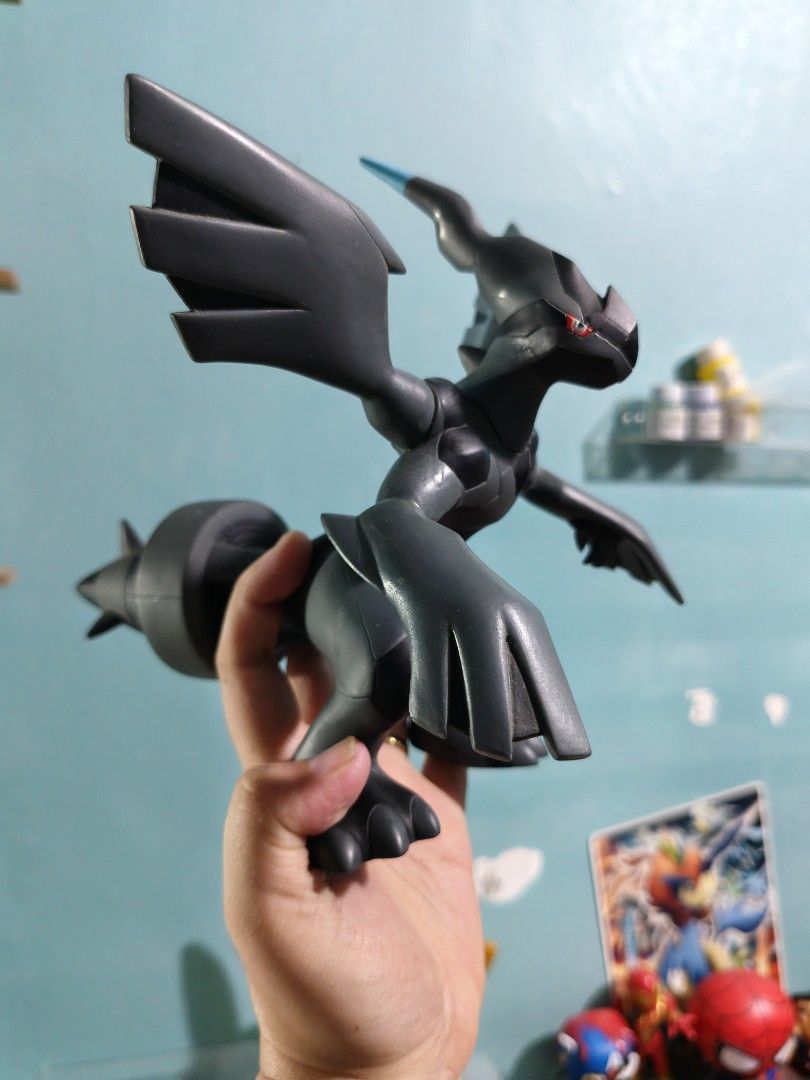 Zekrom Pokémon Banpresto Vinyl Figure (Category: Figurines & Statues) located in Valenzuela. Submitted by chuwie1026 (Listing ID 1465882168, Image 2). Description: - Official 2011 Nintendo copyright stamp on foot - Articulated arms and wings for posing - Made of durable solid vinyl with minimal wear - Iconic black design with blue tail and red eyes - Must-have collectible for Generation 5 fans.