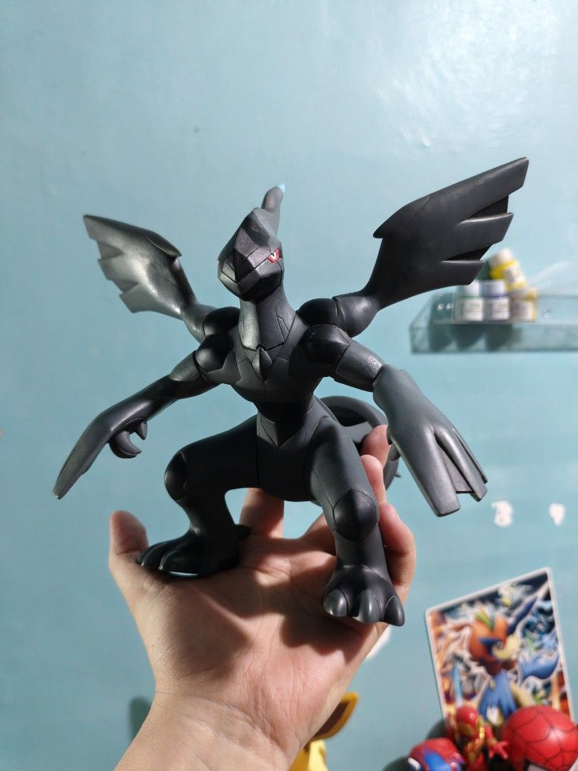Zekrom Pokémon Banpresto Vinyl Figure (Category: Figurines & Statues) located in Valenzuela. Submitted by chuwie1026 (Listing ID 1465882168, Image 1). Description: - Official 2011 Nintendo copyright stamp on foot - Articulated arms and wings for posing - Made of durable solid vinyl with minimal wear - Iconic black design with blue tail and red eyes - Must-have collectible for Generation 5 fans.