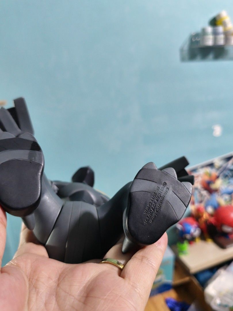 Zekrom Pokémon Banpresto Vinyl Figure (Category: Figurines & Statues) located in Valenzuela. Submitted by chuwie1026 (Listing ID 1465882168, Image 3). Description: - Official 2011 Nintendo copyright stamp on foot - Articulated arms and wings for posing - Made of durable solid vinyl with minimal wear - Iconic black design with blue tail and red eyes - Must-have collectible for Generation 5 fans.