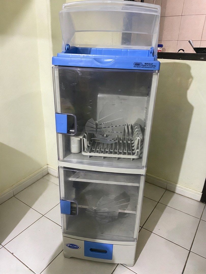 Zooey Primo Dish Organizer/Dish Cabinet (Category: Other Kitchen Appliances) located in Manila. Submitted by mturla4011142 (Listing ID 1465872978, Image 1). Description: This is a Zooey Primo Dish Organizer / Dish Cabinet — yung plastic na lagayan ng plato at baso. Features: Top: With cover, for utensils (you can open it) Middle: Plate rack — yung gray na may slots for plates + small box for spoons/forks Bottom 2 layers: Shelves for bowls, cups, 