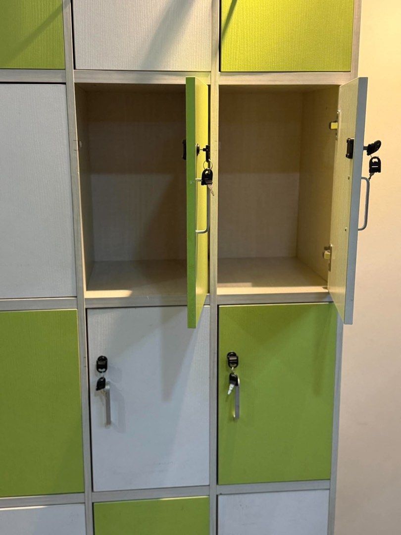 12-Compartment Locker Storage Cabinet White and Green (Category: Shelves, Cabinets & Racks) located in Manila. Submitted by bacsaljose40805 (Listing ID 1466023373, Image 3). Description: - Multi-compartment storage locker with individual locking doors - Stylish alternating white and bright green panels - Secure locks with keys included for every door - Sleek silver pull handles for easy opening - Smooth-opening doors with a sturdy, durable build 