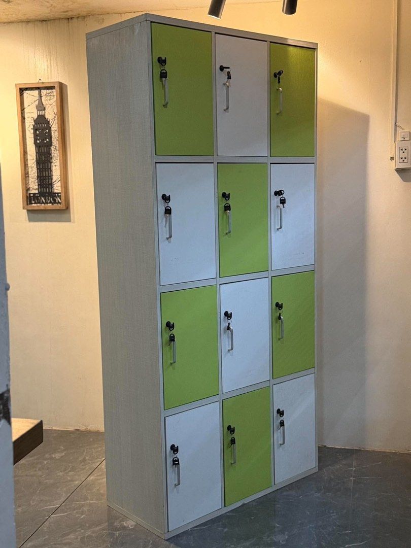 12-Compartment Locker Storage Cabinet White and Green (Category: Shelves, Cabinets & Racks) located in Manila. Submitted by bacsaljose40805 (Listing ID 1466023373, Image 2). Description: - Multi-compartment storage locker with individual locking doors - Stylish alternating white and bright green panels - Secure locks with keys included for every door - Sleek silver pull handles for easy opening - Smooth-opening doors with a sturdy, durable build 