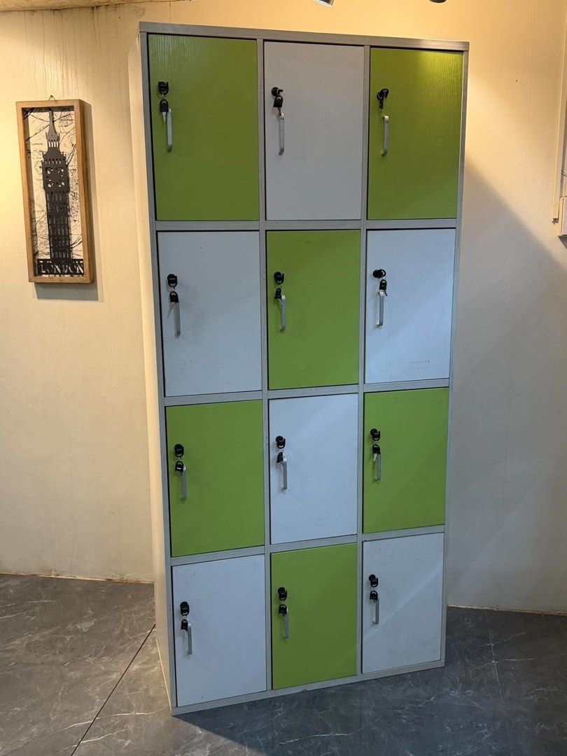 12-Compartment Locker Storage Cabinet White and Green (Category: Shelves, Cabinets & Racks) located in Manila. Submitted by bacsaljose40805 (Listing ID 1466023373, Image 1). Description: - Multi-compartment storage locker with individual locking doors - Stylish alternating white and bright green panels - Secure locks with keys included for every door - Sleek silver pull handles for easy opening - Smooth-opening doors with a sturdy, durable build 