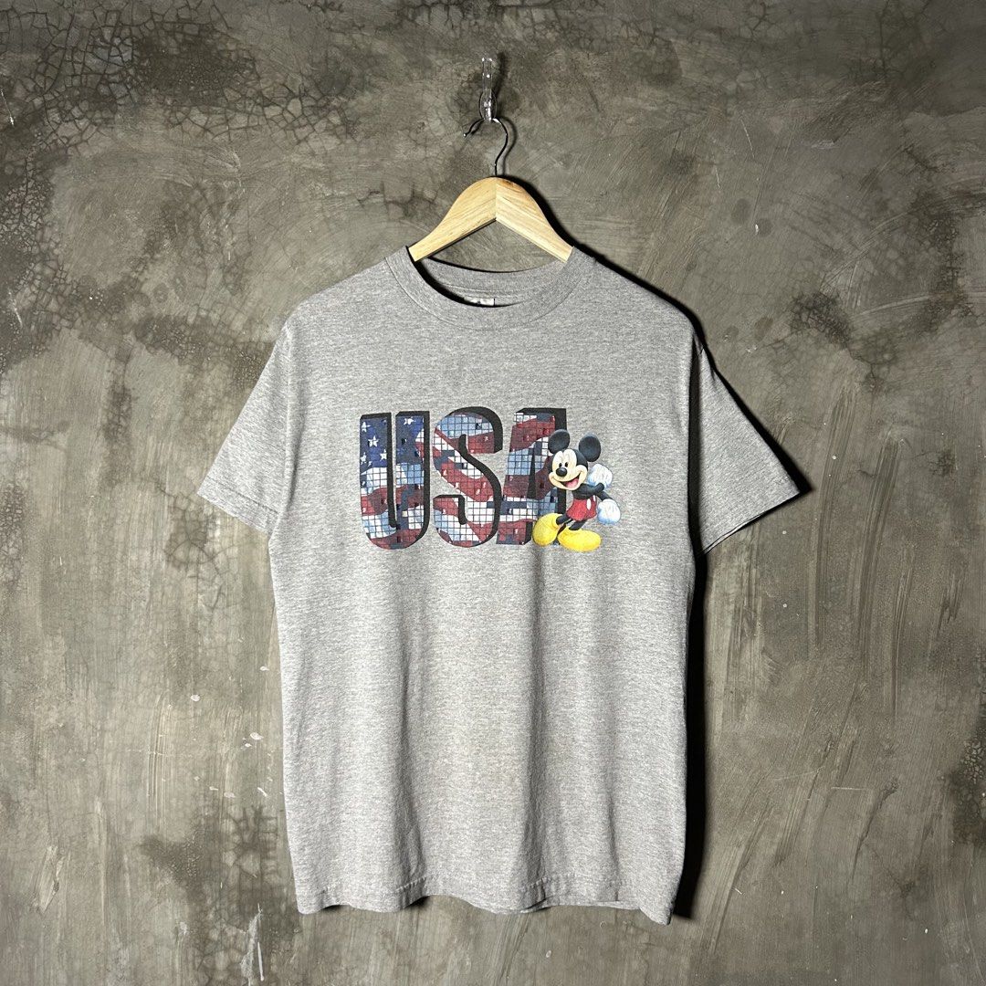 2000’s Mickey USA Shirt (Category: Tshirts & Polo Shirts ) located in Tayabas. Submitted by streetdepartment (Listing ID 1466127108, Image 1). Description: 2000’s Mickey USA Shirt Very good condition Flaw/s: mini hairlines and yellow stain (needswash) Size: Medium Measurements (inches): Width: 19.5” Length: 27.5” Price: 580 + shipping fee Dm to purchase! Note: Manage your expectations as you are dealing with secondhand items. Color may vary due t