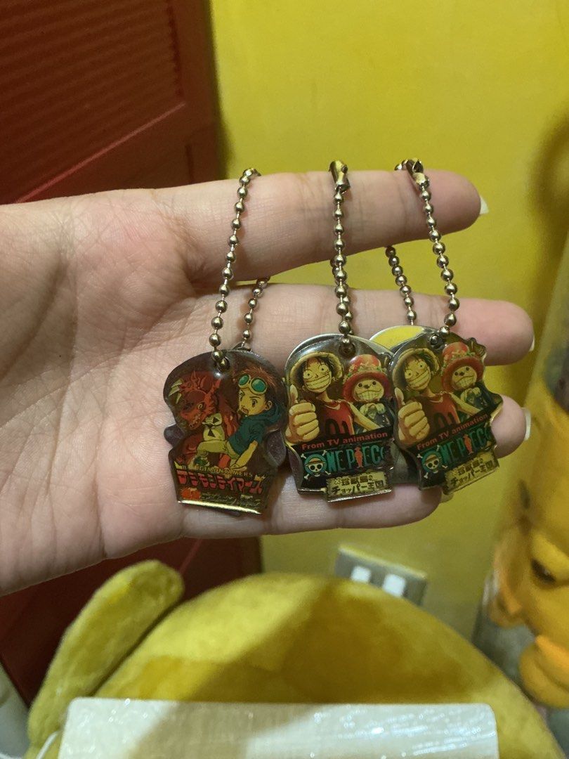 2002 One Piece Digimon Tamers Metal Keychains (Category: Character Goods) located in Marikina City. Submitted by raikee (Listing ID 1466098371, Image 3). Description: Rare 2002 vintage One Piece and Digimon Tamers metal keychain bundle. Durable metal charms with ball chains and authentic back stamps. Shows minor age-related wear. Great collectible for retro anime fans. 75 each 3pcs available. MOP: Gcash,Maya or GoTyme MOD: JnT (SF shouldered by b