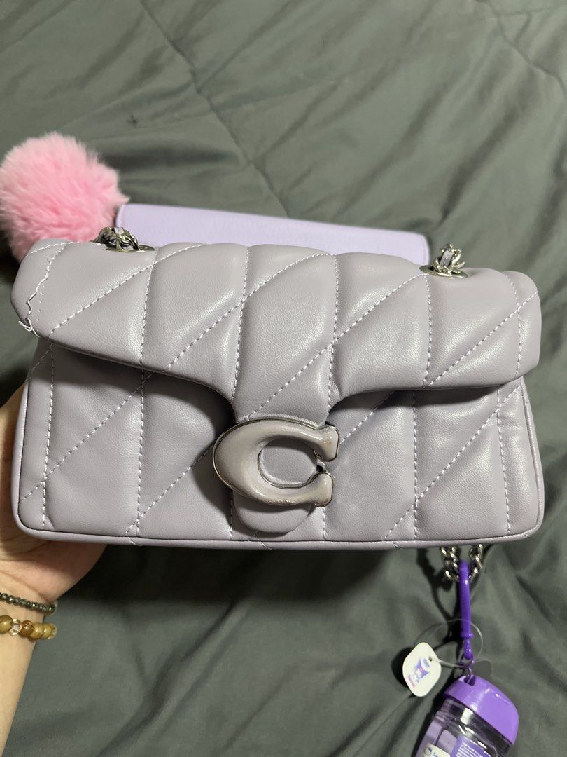2 Pieces preloved Coach Purple Tabby Shoulder Bag (Category: Shoulder Bags) located in Pasig City. Submitted by melaiski28 (Listing ID 1465977465, Image 2). Description: - Coach shoulder bag in gorgeous light purple leather -OEM - Silver-tone hardware with iconic signature C clasp closure - Includes a stylish chain strap for versatile wear - Features a convenient front slip pocket under the flap - Interior includes a secure zipped compartment and