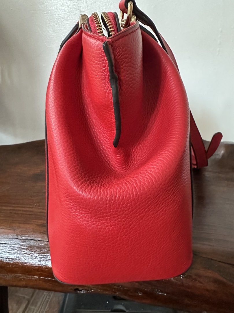 2 way stand alone bag (Category: Shoulder Bags) located in Manila. Submitted by joanparungao012022 (Listing ID 1466057778, Image 2). Description: * preloved bag * Color: red * Features: twoway * Material: leather * This is a second hand bag please manage your expectations * Flaws: faded cartier name Signs of usage * All bag are not-guaranteed (NGA) since it is bought from japan online seller * Its up to you to decide * Sf not included.