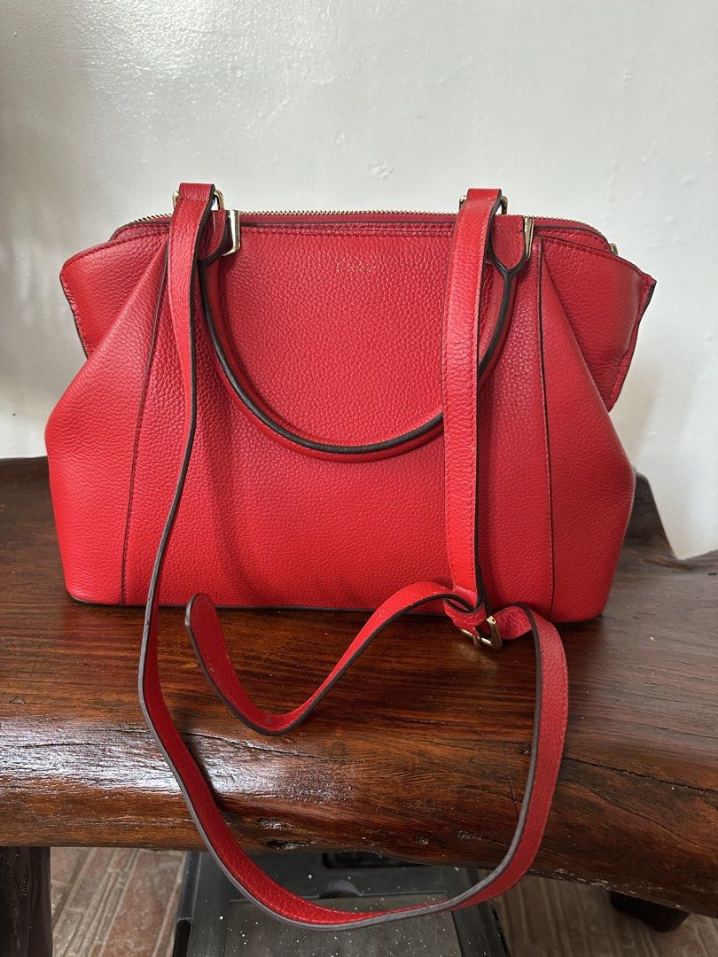2 way stand alone bag (Category: Shoulder Bags) located in Manila. Submitted by joanparungao012022 (Listing ID 1466057778, Image 1). Description: * preloved bag * Color: red * Features: twoway * Material: leather * This is a second hand bag please manage your expectations * Flaws: faded cartier name Signs of usage * All bag are not-guaranteed (NGA) since it is bought from japan online seller * Its up to you to decide * Sf not included.