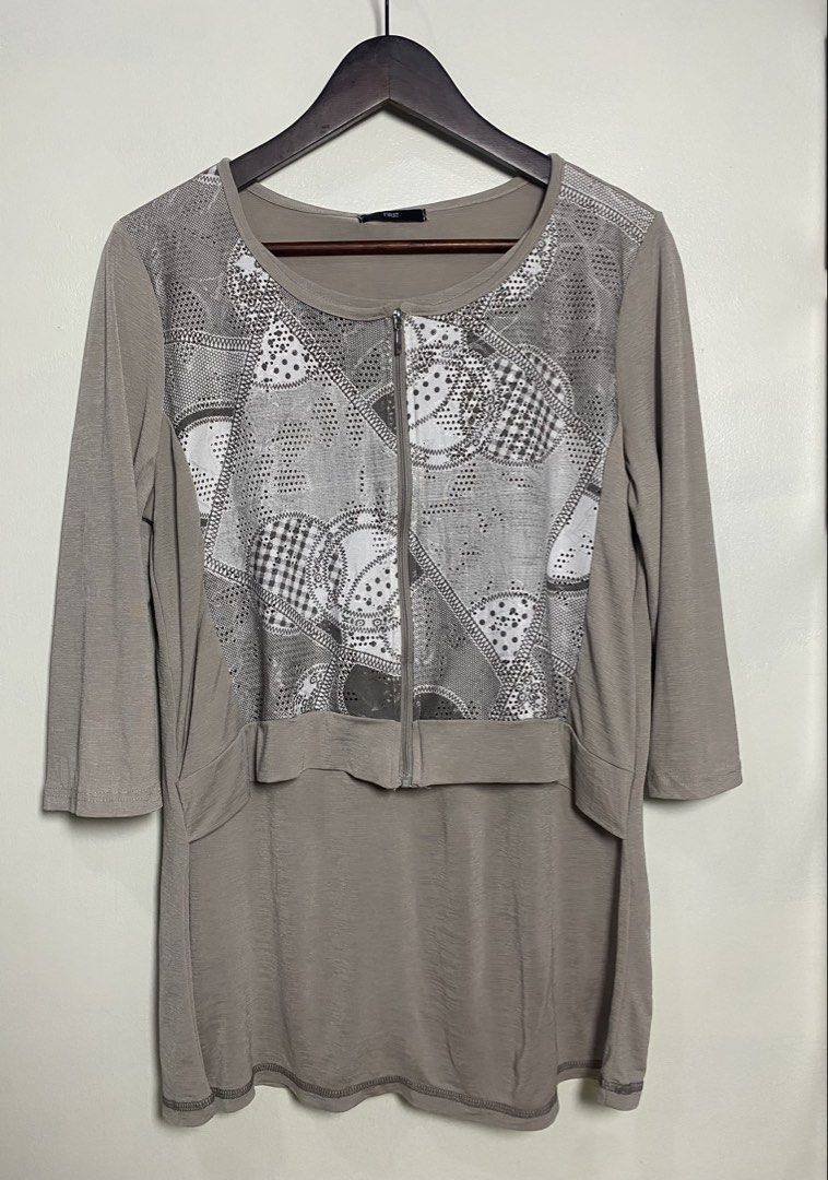 3/4 Japan zip top blouse (Category: Blouses) located in Makati City. Submitted by indaysukaycloset (Listing ID 1466015999, Image 1). Description: FIRST JAPAN ZIP TOP - BRAND NEW WITH TAG Brand: FIRST - Japan Brand Color: Taupe / Beige-Gray Size: M-L on tag Details: - Front zip closure - Front panel: Patchwork eyelet lace print (polka / gingham / lace pattern) - with studs / perforated - Back & sleeves: Plain soft stretch fabric - Material: Polyes