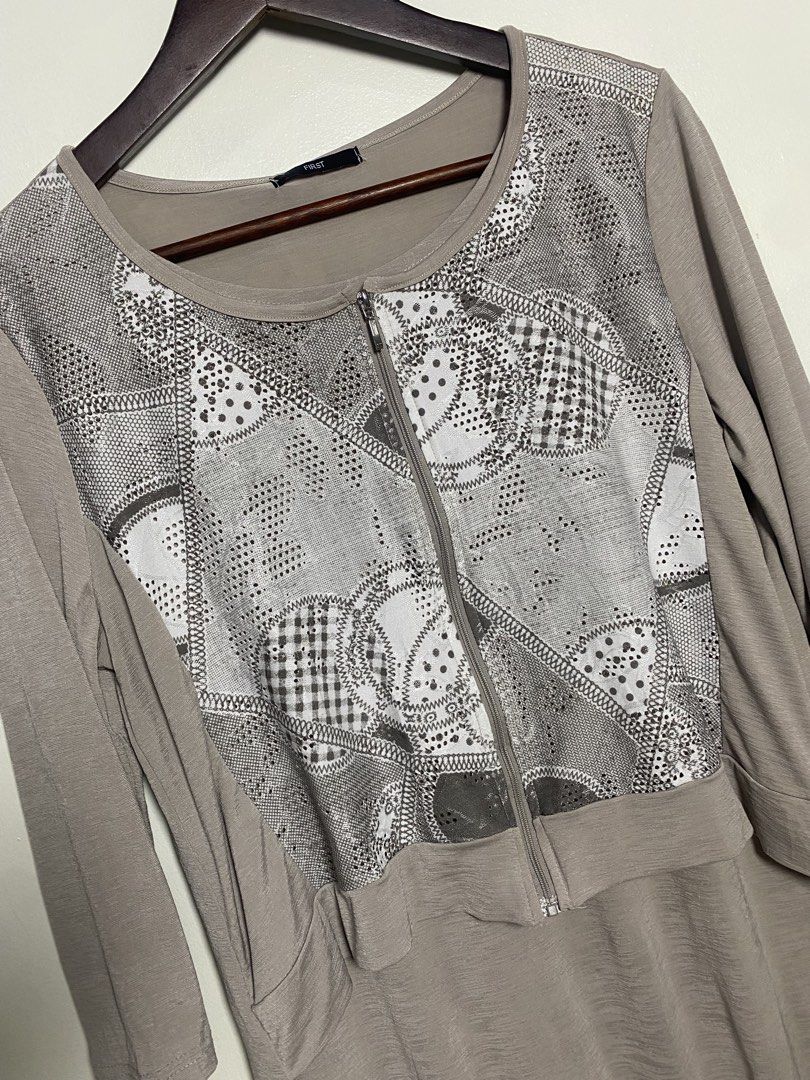 3/4 Japan zip top blouse (Category: Blouses) located in Makati City. Submitted by indaysukaycloset (Listing ID 1466015999, Image 2). Description: FIRST JAPAN ZIP TOP - BRAND NEW WITH TAG Brand: FIRST - Japan Brand Color: Taupe / Beige-Gray Size: M-L on tag Details: - Front zip closure - Front panel: Patchwork eyelet lace print (polka / gingham / lace pattern) - with studs / perforated - Back & sleeves: Plain soft stretch fabric - Material: Polyes
