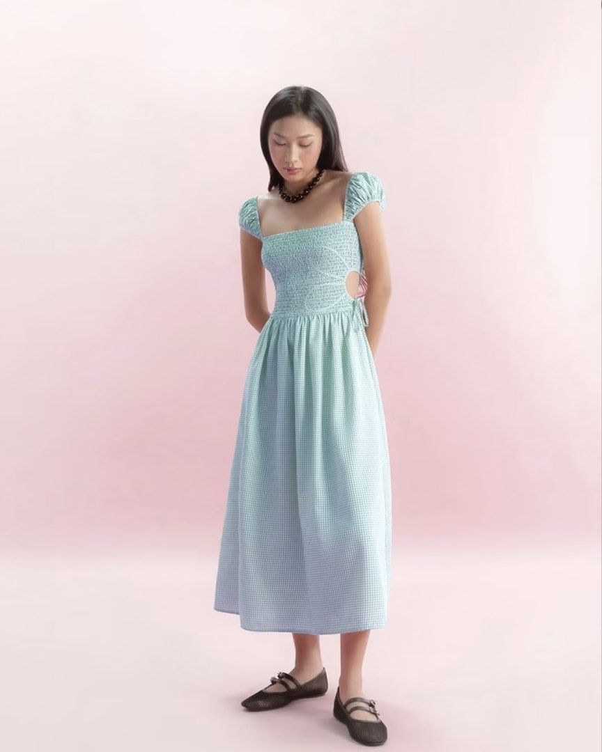 🇻🇳 Libe Workshop Sage Green Gingham Midi Dress (Category: Dresses) located in Mandaluyong City. Submitted by im.a.shopaholic (Listing ID 1466092154, Image 1). Description: - Sage green and white gingham dress, bought in Vietnam - Length: Midi (hits around mid-calf) - Design: Square neckline, short puff sleeves, smocked bodice, and cute side cutout with tie detail.