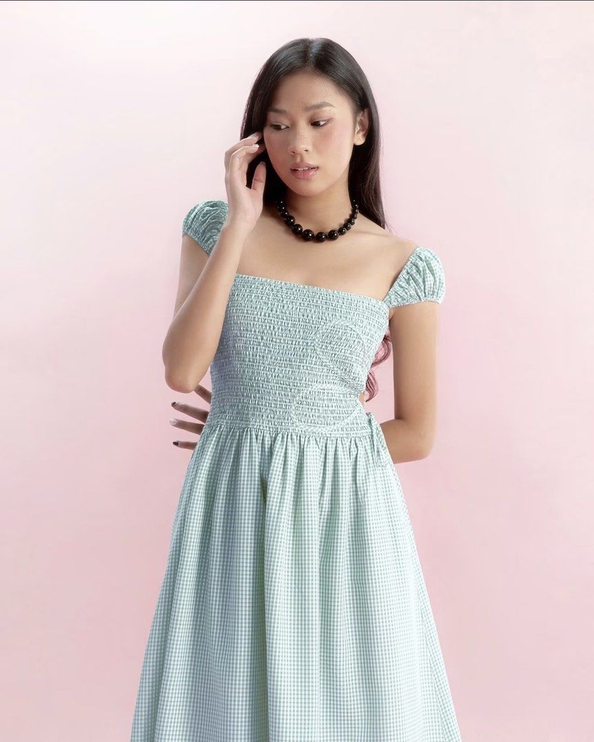 🇻🇳 Libe Workshop Sage Green Gingham Midi Dress (Category: Dresses) located in Mandaluyong City. Submitted by im.a.shopaholic (Listing ID 1466092154, Image 3). Description: - Sage green and white gingham dress, bought in Vietnam - Length: Midi (hits around mid-calf) - Design: Square neckline, short puff sleeves, smocked bodice, and cute side cutout with tie detail.