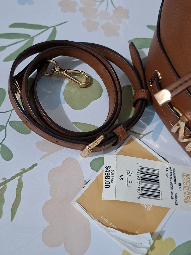 👜✨ Michael Kors Reed Medium Bucket Bag (Category: Luxury Bags & Wallets) located in Taguig. Submitted by authprelovedonlineshop2 (Listing ID 1466010494, Image 2). Description: ### 👜✨ Michael Kors Reed Medium Bucket Bag **Like New! 🇺🇸 Bought in the USA | Guaranteed Authentic!** - **Michael Kors Reed Bucket Bag** - **Medium size** - 🇺🇸 **Bought at a mall in the USA** - **Like-new condition** - ✨ Gold-tone hardware - **Drawstring fastening** -