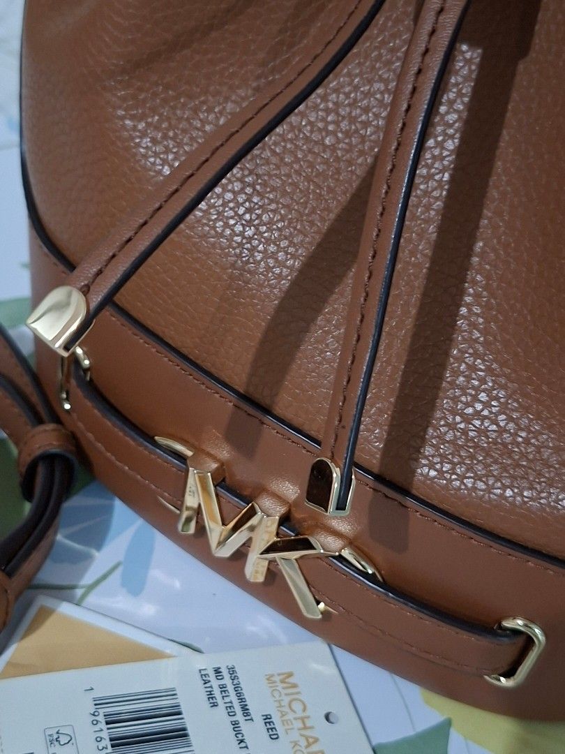 👜✨ Michael Kors Reed Medium Bucket Bag (Category: Luxury Bags & Wallets) located in Taguig. Submitted by authprelovedonlineshop2 (Listing ID 1466010494, Image 3). Description: ### 👜✨ Michael Kors Reed Medium Bucket Bag **Like New! 🇺🇸 Bought in the USA | Guaranteed Authentic!** - **Michael Kors Reed Bucket Bag** - **Medium size** - 🇺🇸 **Bought at a mall in the USA** - **Like-new condition** - ✨ Gold-tone hardware - **Drawstring fastening** -