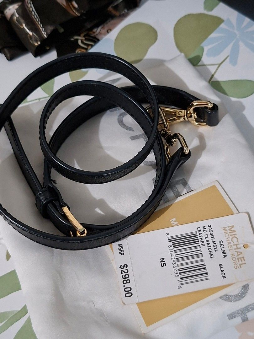 👜✨ Michael Kors Selma – Saffiano Leather (Category: Cross-body Bags) located in Taguig. Submitted by authprelovedonlineshop2 (Listing ID 1466009814, Image 2). Description: ### 👜✨ Michael Kors Selma – Saffiano Leather **Classic & Elegant Michael Kors Bag! 🤎** - **Michael Kors Selma** - **Saffiano leather** - **Excellent condition** - 🇺🇸 **Bought in the USA** - Comes with **care card & dust bag** - 🎀 **FREE twillies included!** - Perfect for 