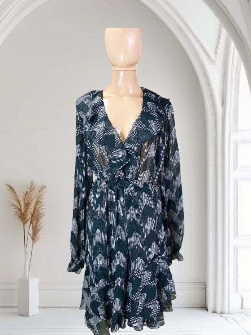 ✨ TED BAKER Talini Ruffle Wrap Mini Dress ✨ (Category: Dresses) located in Manila. Submitted by shopyourstyleph (Listing ID 1466145145, Image 3). Description: Rare & Pretty 🌸💕 Can be fit to S/M body frame Ted Baker Talini Ruffle Wrap Mini Dress. Design: Semi-sheer, lightweight georgette chiffon fabric embellished with fine metallic threading. Pattern: An all-over geometric chevron/herringbone print in black and white. Details: Features a plungi