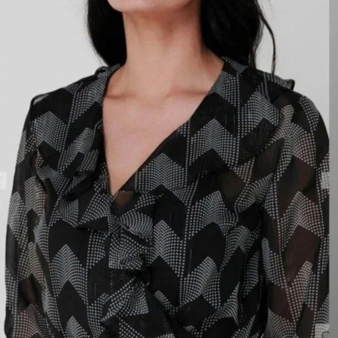 ✨ TED BAKER Talini Ruffle Wrap Mini Dress ✨ (Category: Dresses) located in Manila. Submitted by shopyourstyleph (Listing ID 1466145145, Image 2). Description: Rare & Pretty 🌸💕 Can be fit to S/M body frame Ted Baker Talini Ruffle Wrap Mini Dress. Design: Semi-sheer, lightweight georgette chiffon fabric embellished with fine metallic threading. Pattern: An all-over geometric chevron/herringbone print in black and white. Details: Features a plungi