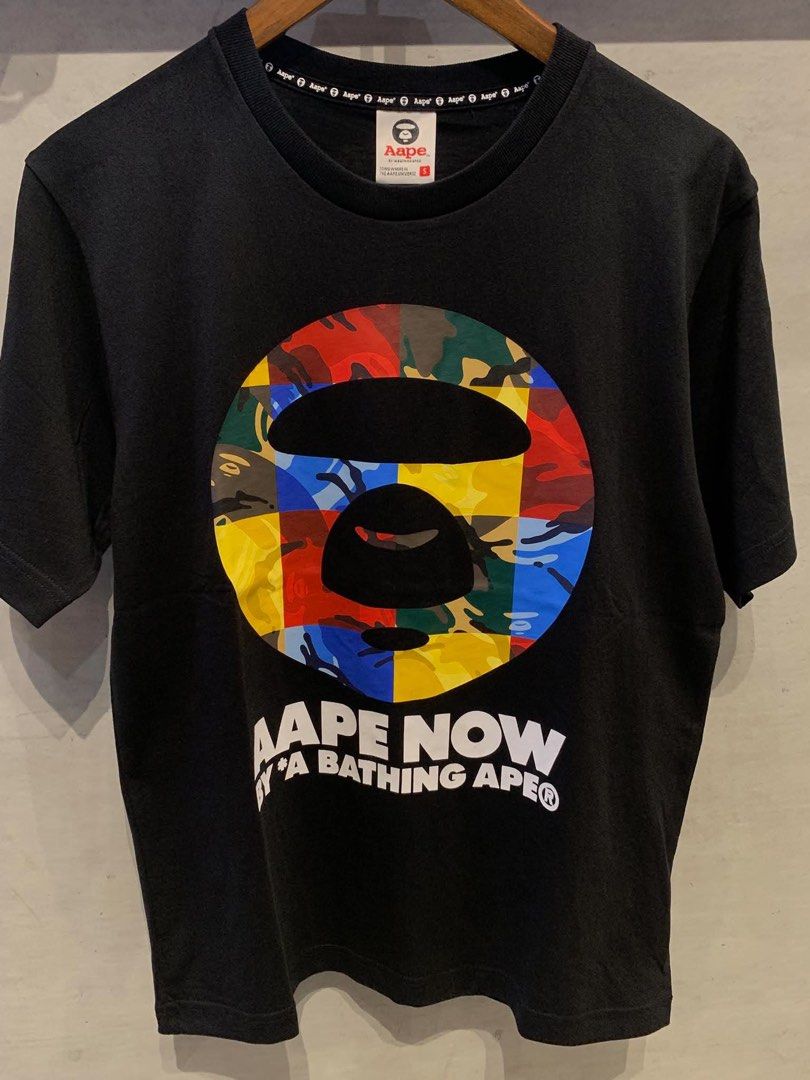 AAPE by A Bathing Ape graphic T-shirt (Category: Tshirts & Polo Shirts ) located in Imus. Submitted by vdc.apparel (Listing ID 1466155336, Image 1). Description: AAPE by A Bathing Ape graphic T-shirt •colorful geometric camo ape head logo on the chest. .