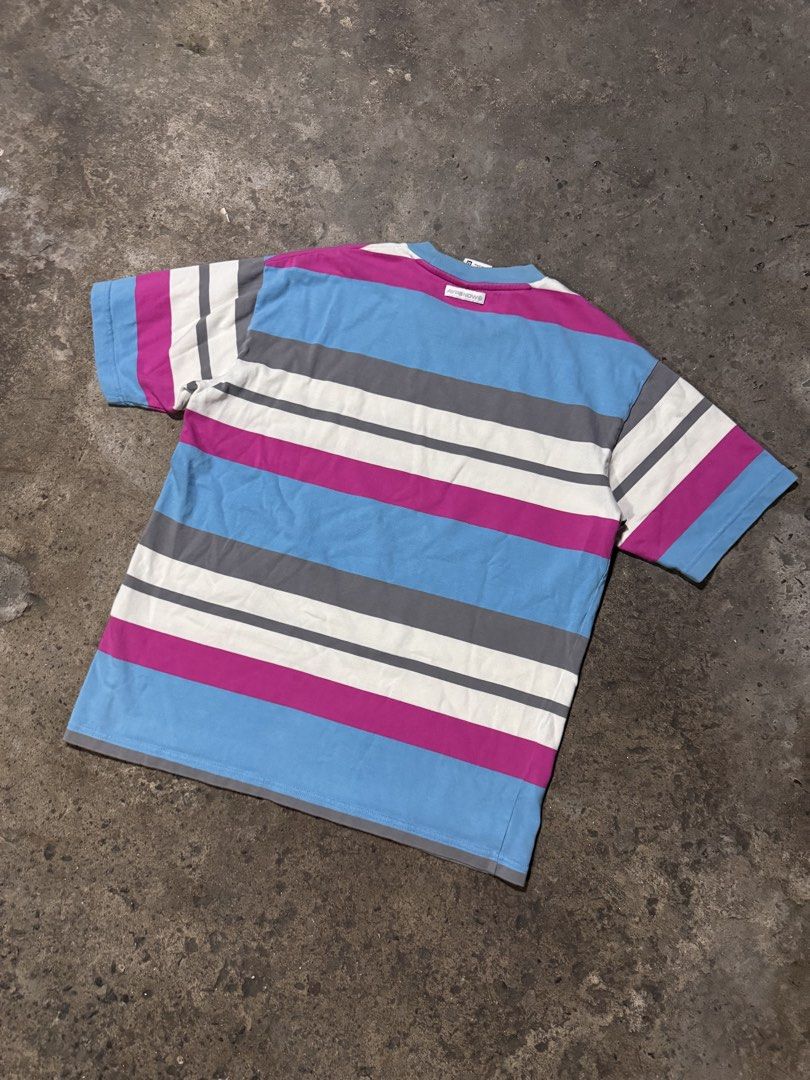 Aape By A Bathing Ape Striped T-Shirt (Category: Tshirts & Polo Shirts ) located in Pasig City. Submitted by dripthrift1600 (Listing ID 1466098046, Image 2). Description: - Brand: Aape by A Bathing Ape - Colorway: Blue, magenta, white, and grey stripes - Size: Medium (tag attached) - Design: Short sleeves, crew neckline - Details: Aape Now woven front tag, chest logo patch, left sleeve branding patch, and back collar label - Dimes: 22x27.