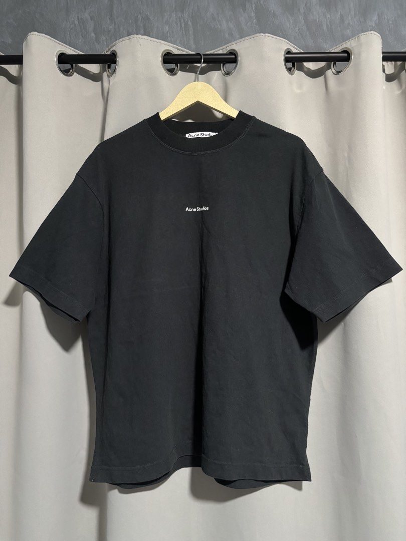 Acne Studios Black Logo Shirt (Category: Tshirts & Polo Shirts ) located in Santa Rosa. Submitted by sheabuys (Listing ID 1465961321, Image 1). Description: - Brand: Acne Studios - Color: Black with white logo text on the front - Size: Medium (M) - Fit: Relaxed fit, crewneck with a thick ribbed collar - Material: 100% heavy cotton, Made in Portugal - Details: Style code FN-MN-TSHI000245 on care label - Condition: 100% authentic and well-maintaine