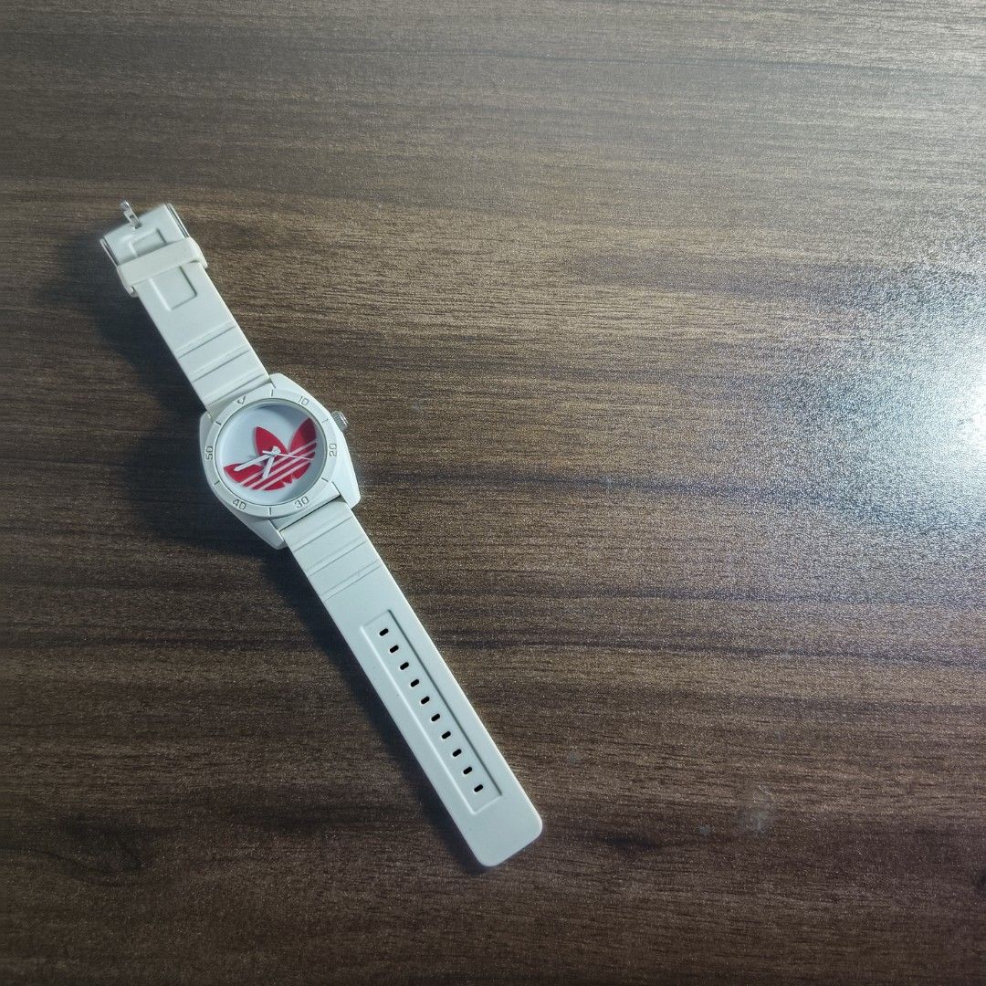 Adidas ADH2980 Watch (Category: Men's Watches) located in Antipolo. Submitted by soon2byours_ (Listing ID 1466075899, Image 1). Description: - Authentic Adidas ADH2820 watch - Clean white design with striking red Trefoil logo on dial - Durable and comfortable white silicone strap with secure steel buckle - Features the Adidas logo engraved on the crown - Great everyday casual or streetwear accessory.