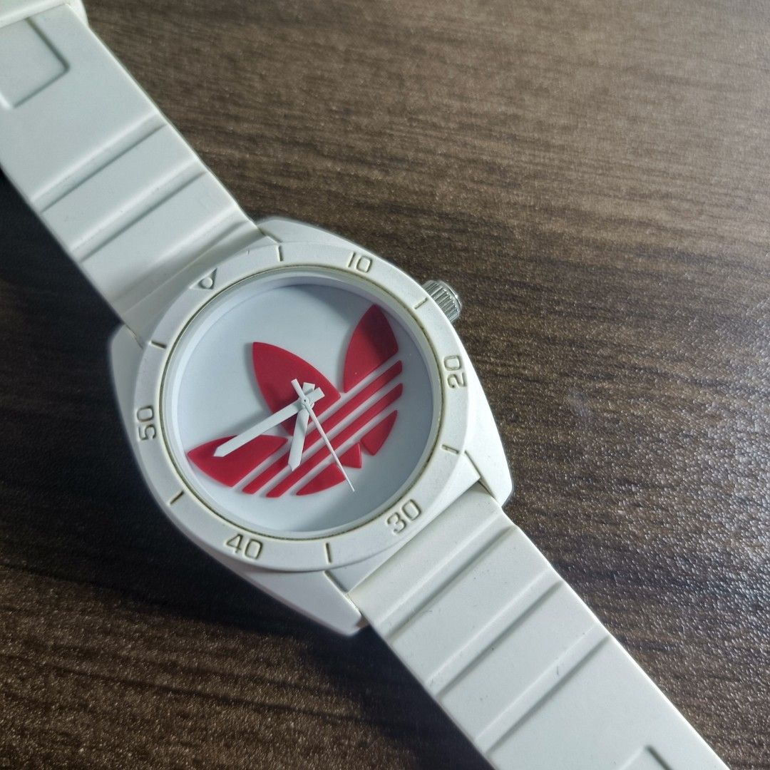 Adidas ADH2980 Watch (Category: Men's Watches) located in Antipolo. Submitted by soon2byours_ (Listing ID 1466075899, Image 3). Description: - Authentic Adidas ADH2820 watch - Clean white design with striking red Trefoil logo on dial - Durable and comfortable white silicone strap with secure steel buckle - Features the Adidas logo engraved on the crown - Great everyday casual or streetwear accessory.