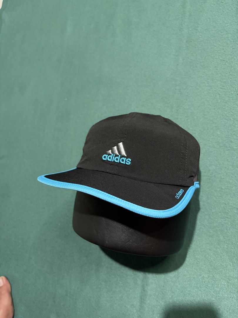 Adidas Adizero Running Cap Black Blue (Category: Caps & Hats) located in Guihulngan. Submitted by fbthriftgoodsniace (Listing ID 1466013482, Image 2). Description: Black Adidas Adizero running cap with vibrant blue piping along the brim. Silver embroidered Adidas logo on the front, adizero text branding on the side. Adjustable hook-and-loop strap in the back featuring a small rubber Adidas tag. Lightweight athletic material with an inner sweatban