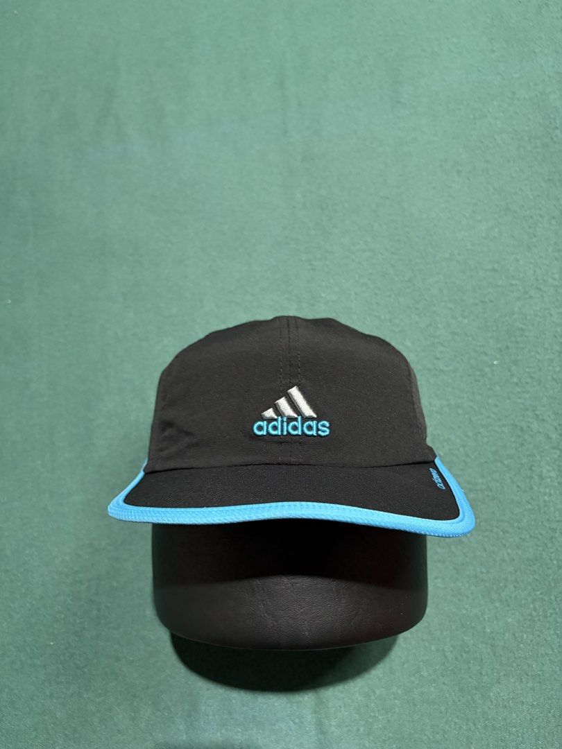 Adidas Adizero Running Cap Black Blue (Category: Caps & Hats) located in Guihulngan. Submitted by fbthriftgoodsniace (Listing ID 1466013482, Image 1). Description: Black Adidas Adizero running cap with vibrant blue piping along the brim. Silver embroidered Adidas logo on the front, adizero text branding on the side. Adjustable hook-and-loop strap in the back featuring a small rubber Adidas tag. Lightweight athletic material with an inner sweatban