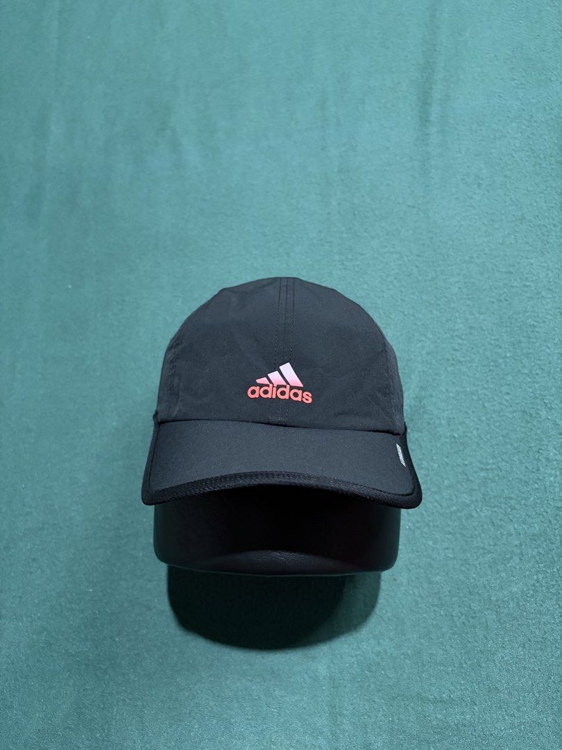 Adidas Aeroready Running Cap Black Pink Gradient (Category: Caps & Hats) located in Guihulngan. Submitted by fbthriftgoodsniace (Listing ID 1466005562, Image 1). Description: - Brand: Adidas - Color: Black with gradient pink and white logo - Tech: AEROREADY (sweat-wicking and quick-dry) - Fit: Adjustable strap with small Adidas branding tag - Condition: Excellent, clean inside and out - Ideal for: Running, workouts, and outdoor activities.