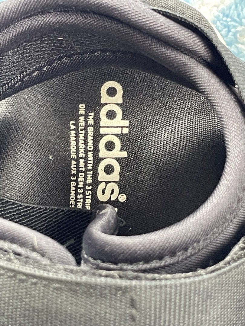Adidas Black Sandals (Category: Flats & Sandals) located in Zamboanga. Submitted by stephoney03 (Listing ID 1466037928, Image 2). Description: - Brand: Adidas - Color: Black with textured white base - Features: Adjustable strap closures for a secure fit - Branding: Iconic Adidas trefoil logo on footbed and side midsole - Condition: Brand new / Excellent daily wear - Ideal for: Casual outings, beach trips, and warm weather.