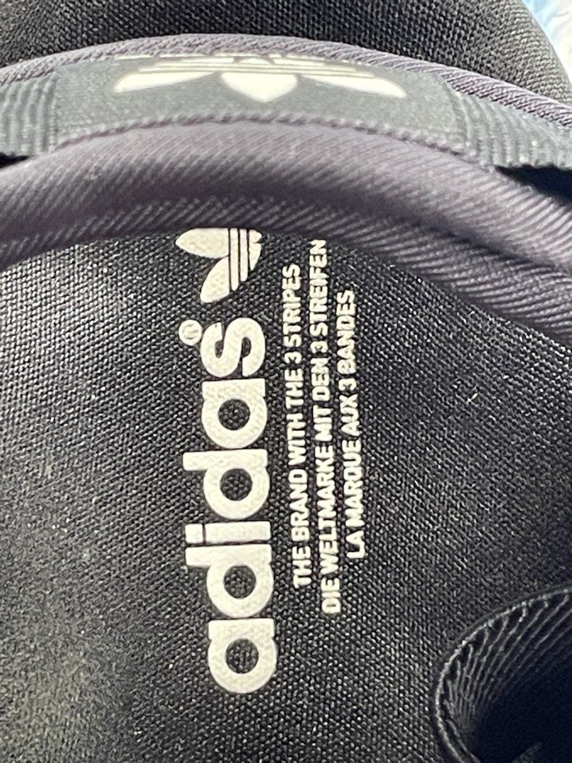 Adidas Black Sandals (Category: Flats & Sandals) located in Zamboanga. Submitted by stephoney03 (Listing ID 1466037928, Image 3). Description: - Brand: Adidas - Color: Black with textured white base - Features: Adjustable strap closures for a secure fit - Branding: Iconic Adidas trefoil logo on footbed and side midsole - Condition: Brand new / Excellent daily wear - Ideal for: Casual outings, beach trips, and warm weather.