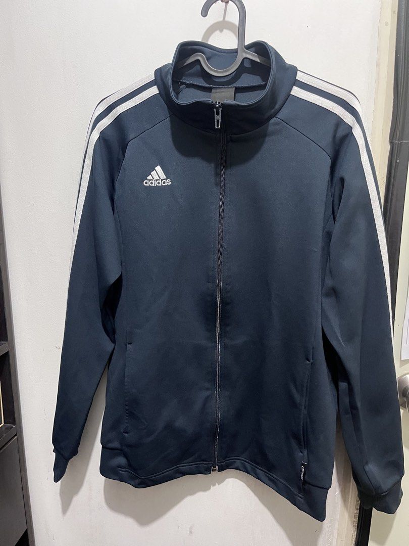 Adidas Climalite Track Jacket Navy Blue Medium to Large (Category: Coats, Jackets and Outerwear) located in Antipolo. Submitted by euntak (Listing ID 1466096301, Image 1). Description: - Authentic Adidas zip-up track jacket in dark navy blue - Iconic white three-stripe branding along both sleeves - High collar and full zipper closure for a classic look - Convenient side pockets with Climalite tag near the hem - Ribbed cuffs and hem for a snug, co