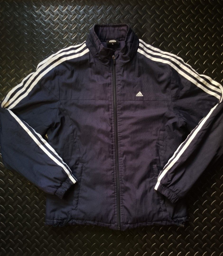 Adidas Dark Blue Track Jacket (Category: Coats, Jackets and Outerwear) located in Baguio. Submitted by bado.feels (Listing ID 1466153856, Image 1). Description: Size Xl on tag can fit to medium to large Width 20 Length 25 Sleeves 23 450+sf Baguio Loc.