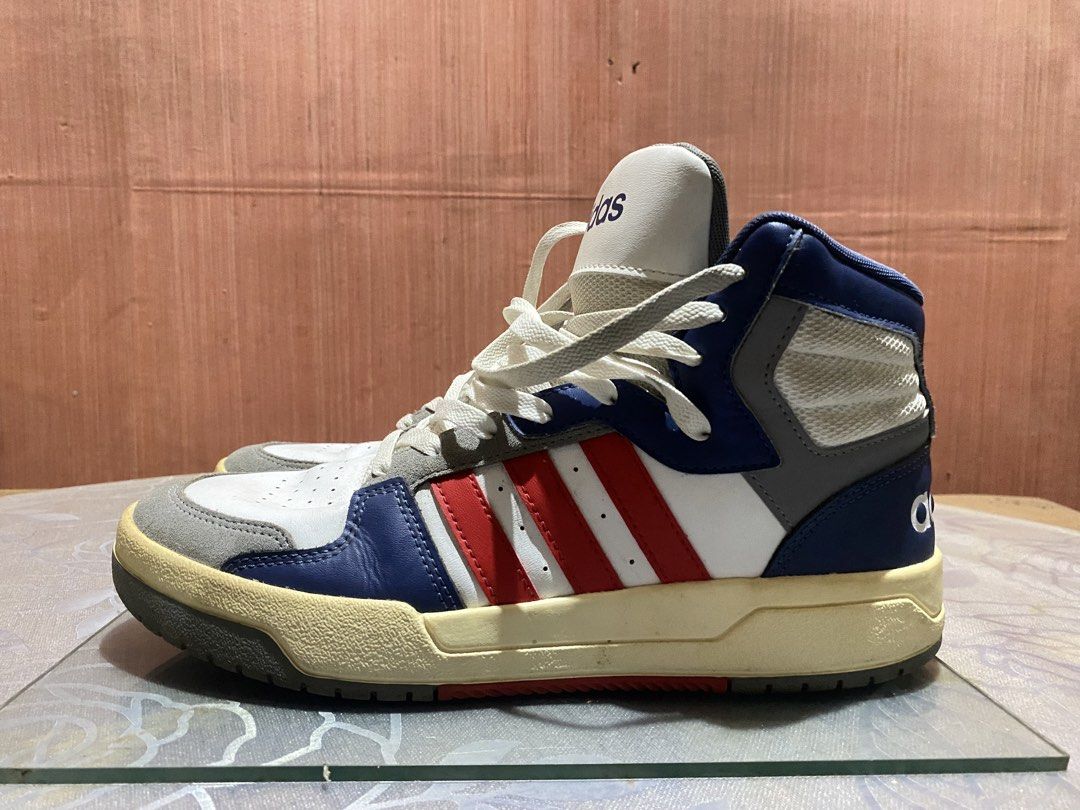Adidas Entrap Mid Dark Blue and Red (Category: Sneakers) located in Manila. Submitted by dropndrip (Listing ID 1466039559, Image 2). Description: - Brand: Adidas High Top Sneakers - Colorway: White, Red, and Blue - Size: US 9 / UK 8.5 / EU 42 2/3 - Details: Suede toe overlays, classic three stripes, and bold branding on heels and tongues - Comfort: Well-padded ankles for extra support - Condition: Yellowed midsoles due to age, but soles still hav
