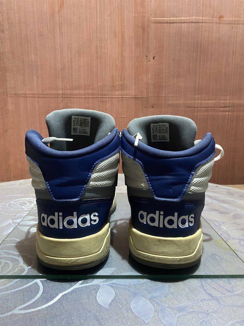 Adidas Entrap Mid Dark Blue and Red (Category: Sneakers) located in Manila. Submitted by dropndrip (Listing ID 1466039559, Image 3). Description: - Brand: Adidas High Top Sneakers - Colorway: White, Red, and Blue - Size: US 9 / UK 8.5 / EU 42 2/3 - Details: Suede toe overlays, classic three stripes, and bold branding on heels and tongues - Comfort: Well-padded ankles for extra support - Condition: Yellowed midsoles due to age, but soles still hav