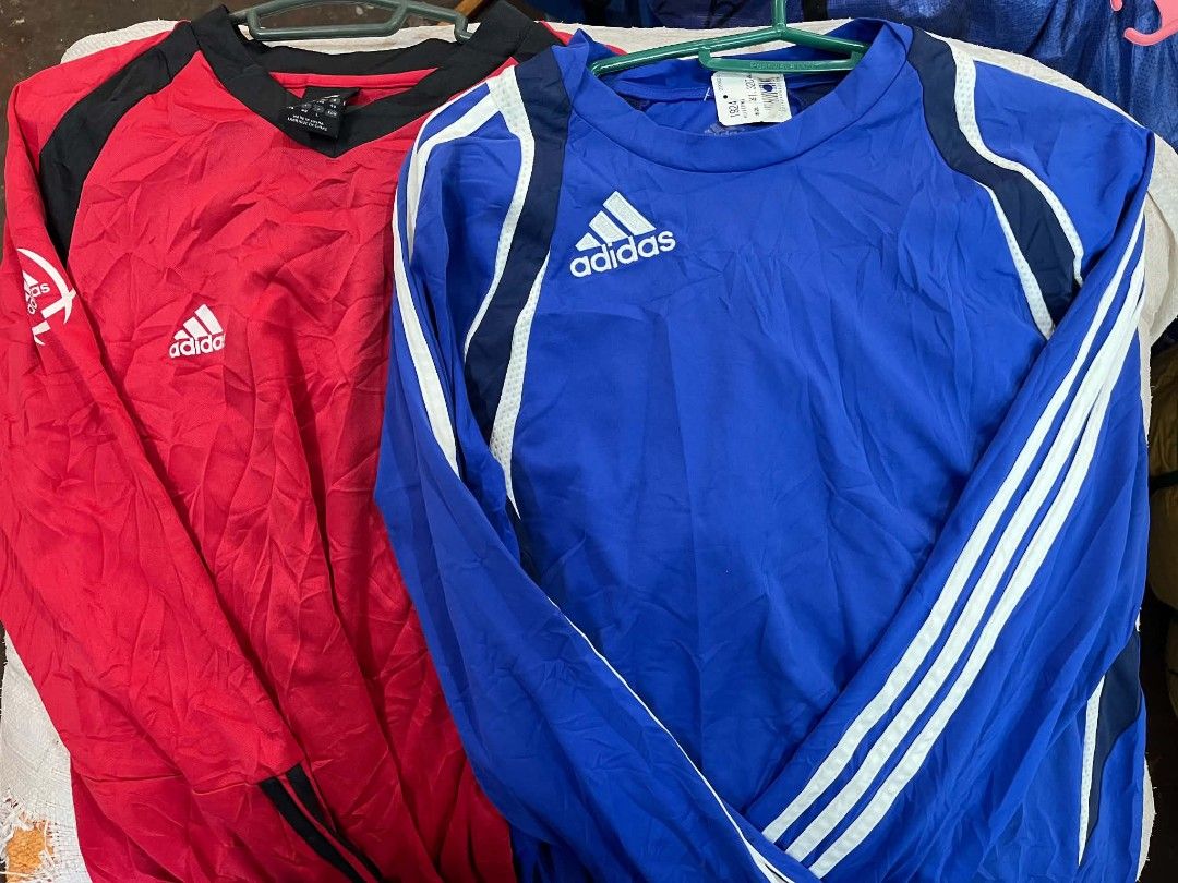 Adidas Long Sleeve Shirts Bundle Red Blue (Category: Longsleeves) located in City of Isabela. Submitted by warmbird.d06e6f (Listing ID 1466079548, Image 1). Description: - Bundle includes 2 Adidas long sleeve athletic shirts: 1 Red (with black collar and white logo) and 1 Royal Blue (with navy/white shoulder stripes and white logo) - Size: US Large (UK 38/40, F 174, D 48) - Classic crew neck design - Made in China - Ideal for workouts, football t