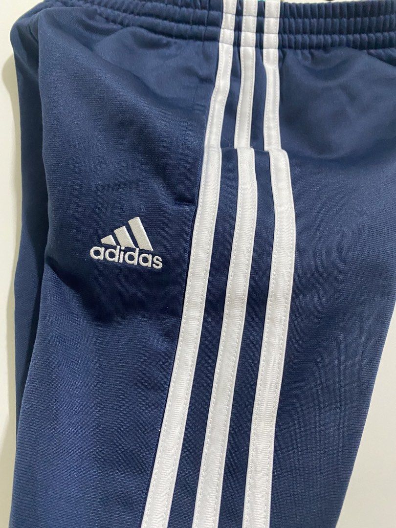 Adidas Navy Blue Track Pants Size 5 (Category: Babies & Kids Fashion) located in Pasig City. Submitted by kittyxhop (Listing ID 1465993752, Image 1). Description: - Brand: Adidas - Color: Navy blue with white three stripes - Logo: Embroidered on left hip - Waistband: Elastic for an easy fit - Condition: Clean fabric, bright stripes - Best for: Workouts or casual lounging *can pass as new! Can fit 5-10yrs old .