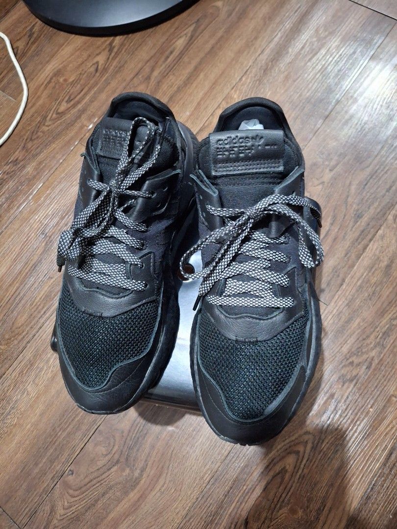 Adidas Nite Jogger Black Sneakers (Category: Sneakers) located in Mandaluyong City. Submitted by shams2026 (Listing ID 1466109384, Image 1). Description: - Brand: adidas - Color: Black with unique patterned laces - Materials: Breathable mesh upper panels and durable leather overlays - Soles: Textured midsoles with reliable rubber outsoles - Details: Iconic adidas trefoil logo stamped on the heel tabs - Condition: Minimal scuffs from regular wear,