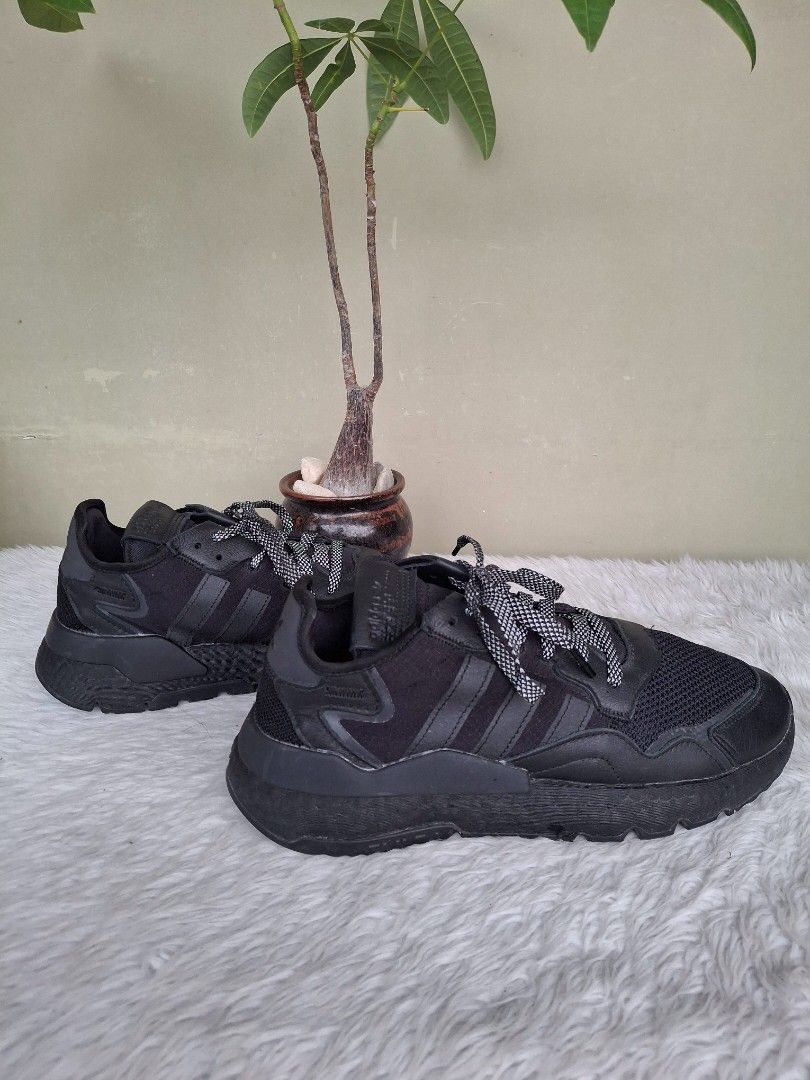Adidas Nite Jogger Black Sneakers (Category: Sneakers) located in Mandaluyong City. Submitted by shams2026 (Listing ID 1466109384, Image 2). Description: - Brand: adidas - Color: Black with unique patterned laces - Materials: Breathable mesh upper panels and durable leather overlays - Soles: Textured midsoles with reliable rubber outsoles - Details: Iconic adidas trefoil logo stamped on the heel tabs - Condition: Minimal scuffs from regular wear,