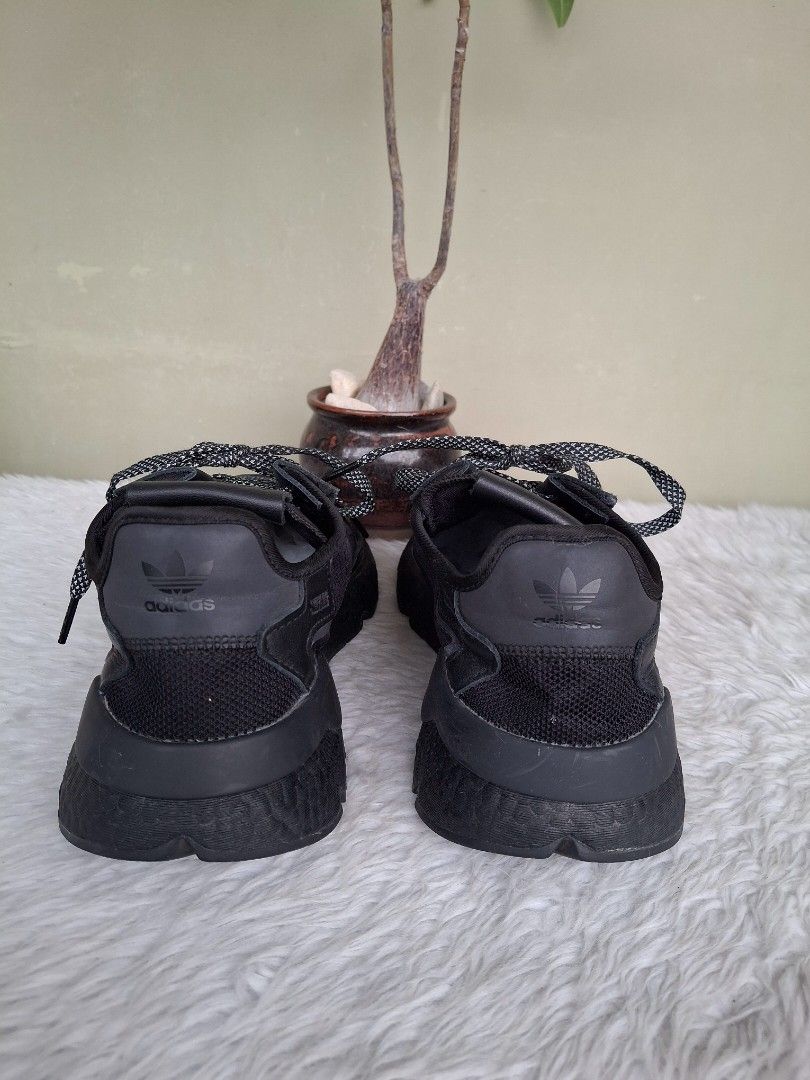 Adidas Nite Jogger Black Sneakers (Category: Sneakers) located in Mandaluyong City. Submitted by shams2026 (Listing ID 1466109384, Image 3). Description: - Brand: adidas - Color: Black with unique patterned laces - Materials: Breathable mesh upper panels and durable leather overlays - Soles: Textured midsoles with reliable rubber outsoles - Details: Iconic adidas trefoil logo stamped on the heel tabs - Condition: Minimal scuffs from regular wear,