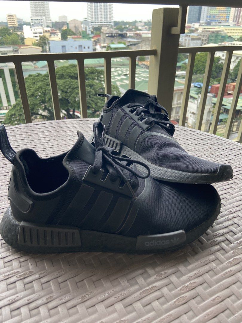 Adidas NMD Triple Black Sneakers (Category: Sneakers) located in Manila. Submitted by fastmoon_419 (Listing ID 1466153889, Image 3). Description: Adidas NMD sneakers in triple black colorway. Knit upper material with classic boost midsole cushioning. Pull tabs at the heel and tongue for easy slip-on. Tonal three stripes on the sides with matching laces and rubber outsole. Great daily rotation kicks for running errands or casual hangouts..