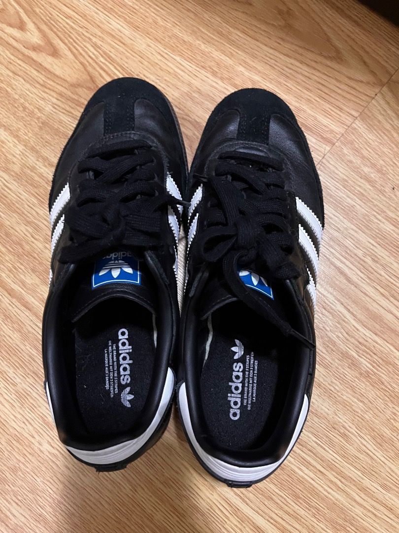 Adidas Samba Black White Sneakers (Category: Sneakers) located in Quezon City. Submitted by shop.e24 (Listing ID 1466063781, Image 3). Description: - Authentic Black and White Adidas Samba sneakers - Barely used. - Classic leather upper with iconic suede toe overlay - Stylish blue branding patch on the tongue and white heel tab - Clean soles showing minimal wear - Size tag fully readable on inner tongue - Highly versatile casual shoes, easy to ma