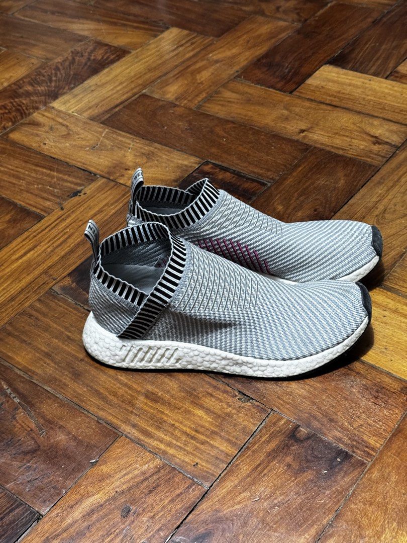 Adidas Slip-on Knit Sneakers (Category: Sneakers) located in Manila. Submitted by ughhlc (Listing ID 1466148359, Image 2). Description: - Flexible grey knit upper for effortless slip-on wear - Stylish black and white striped ribbed collars - Lightweight and textured white foam midsoles for all-day comfort - Handy heel pull tabs with text branding - Versatile everyday casual sneakers.