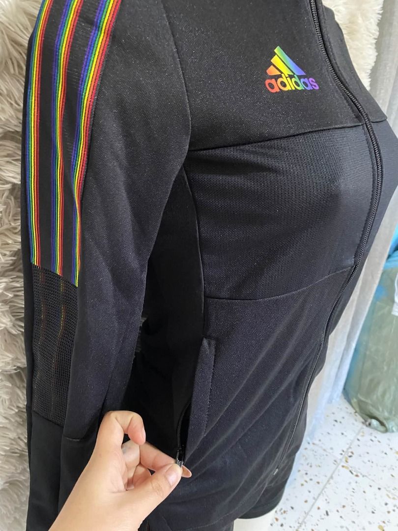 Adidas Tiro Pride Track Jacket in black (Category: Coats, Jackets and Outerwear) located in Caloocan City. Submitted by aine_laine (Listing ID 1466114605, Image 3). Description: Terno Adidas Tiro Pride Track Jacket in black, featuring distinctive rainbow trim and a multicolored adidas logo Brandnew with tags Xs on tags fit till small size Zippered pockets both jacket and short —check nyo price jacket plang pricey na eto terno na po Pang jogging/z