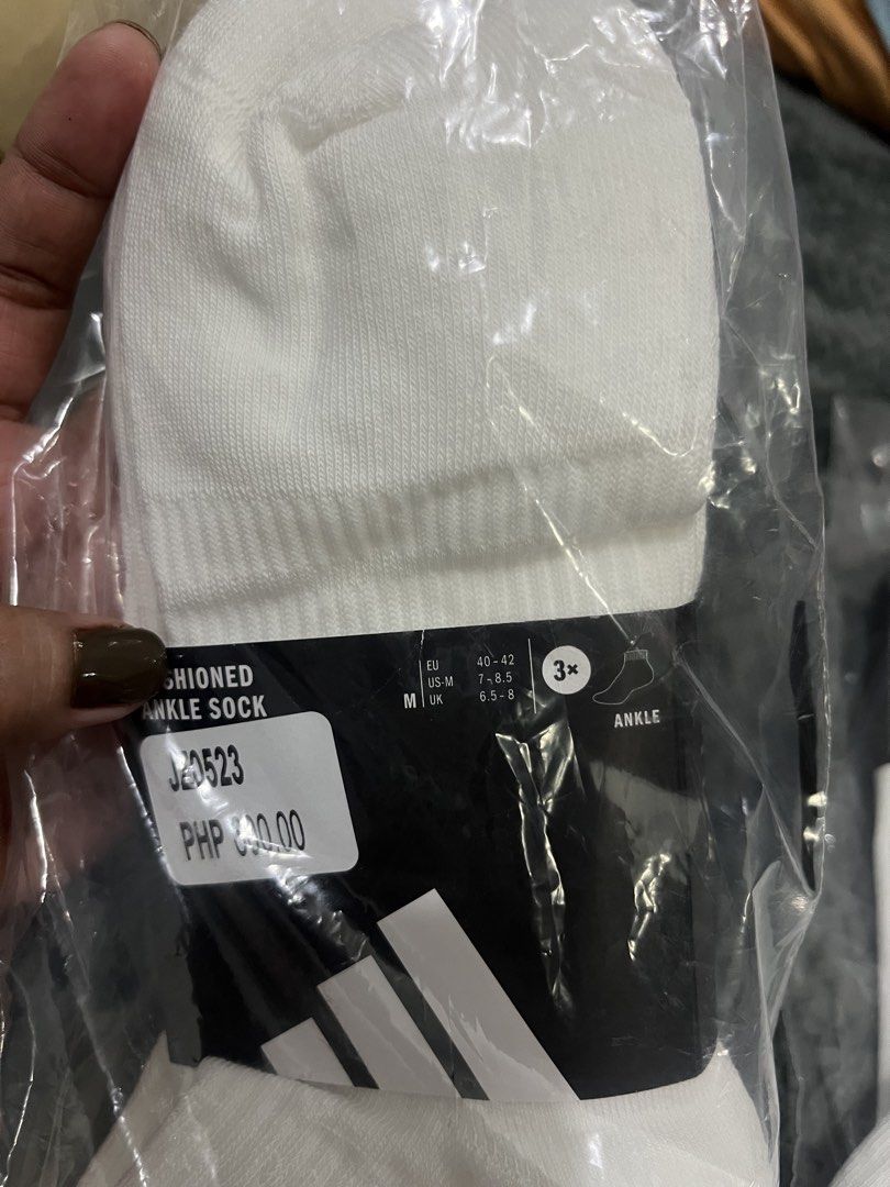 Repriced! Adidas White Ankle Socks 3-Pack (Category: Socks) located in Cebu City. Submitted by iamgee89 (Listing ID 1465968363, Image 3). Description: - Authentic pack of 3 white Adidas ankle socks - Size large - Classic athletic style with comfortable ribbed cuffs - Features stylish grey logo branding near the top - Soft and breathable cotton blend for daily workouts or casual wear - Standard sizing available (refer to the size chart photo).