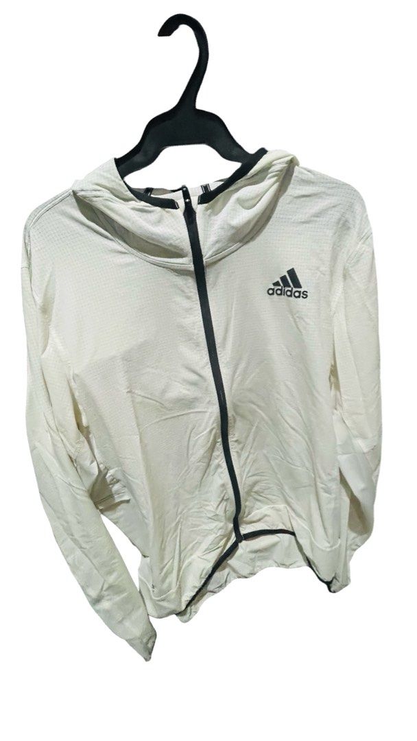 Adidas White Grid Pattern Zip-Up Hoodie (Category: Activewear) located in Quezon City. Submitted by i2ochelle227661 (Listing ID 1465988911, Image 2). Description: Original and purchased in USA - Brand: Adidas - Color: White with black accents - Design: Textured grid pattern all over - Features: Full-length black front zipper, black trim on hood and cuffs, printed black logo on left chest - Material: Lightweight and comfortable - Ideal for: Workou