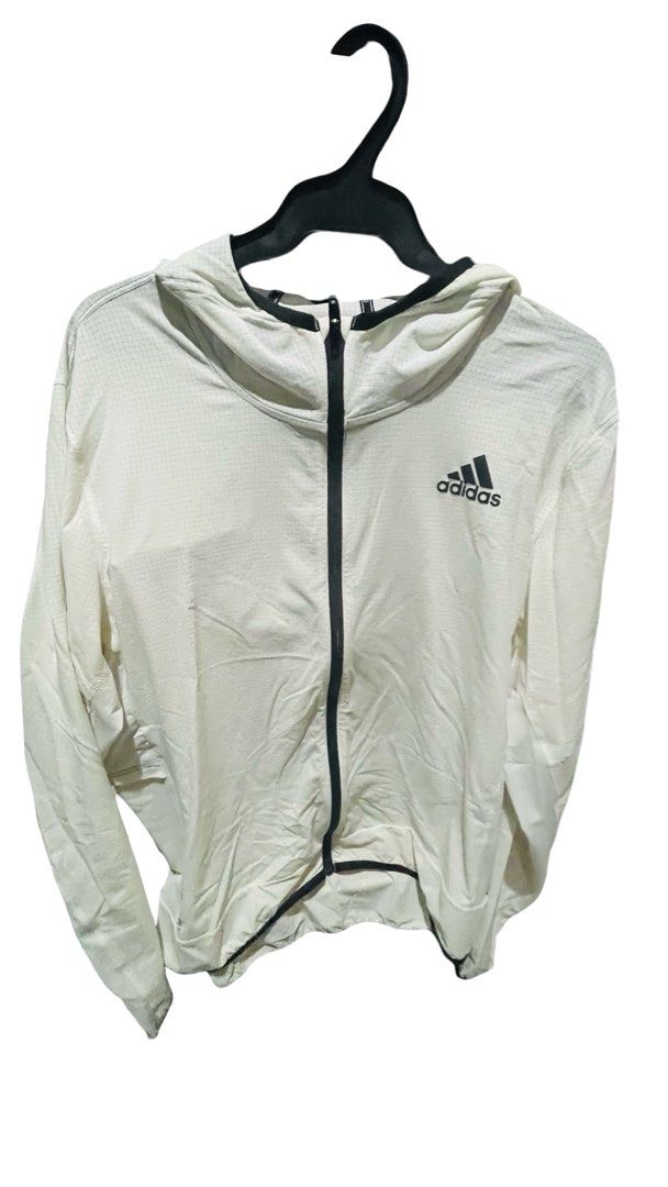 Adidas White Grid Pattern Zip-Up Hoodie (Category: Activewear) located in Quezon City. Submitted by i2ochelle227661 (Listing ID 1465988911, Image 3). Description: Original and purchased in USA - Brand: Adidas - Color: White with black accents - Design: Textured grid pattern all over - Features: Full-length black front zipper, black trim on hood and cuffs, printed black logo on left chest - Material: Lightweight and comfortable - Ideal for: Workou