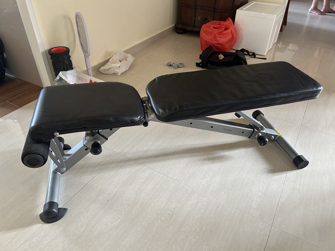 Adjustable Bench solid build (Category: Weights & Dumbbells) located in Singapore. Submitted by pasirrismonkey (Listing ID 1465999501, Image 1). Description: Adjustable workout bench. Multiple incline and flat settings. Foam leg rollers at the front for secure workouts during sit-ups and bench presses. Sturdy metal build with adjustable knobs on the support bars. Easy to fold or adjust angles for home gym routines. Self collection .